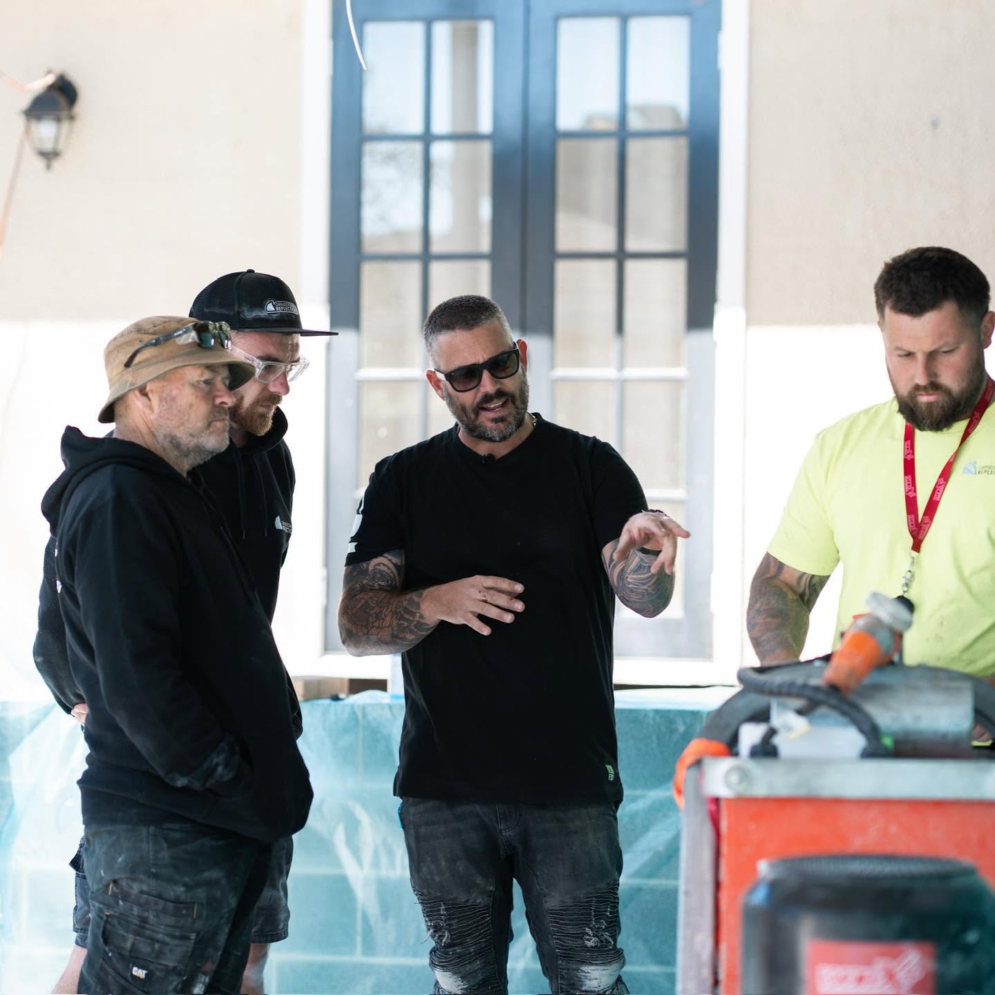 The Epoxy School trainers demonstrating technique on a live workshop floor